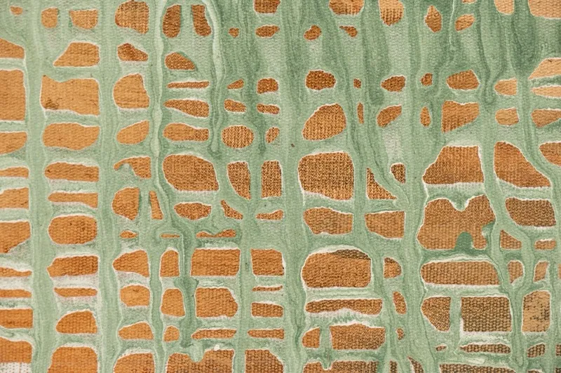 Textura verde e dourada em cerâmica